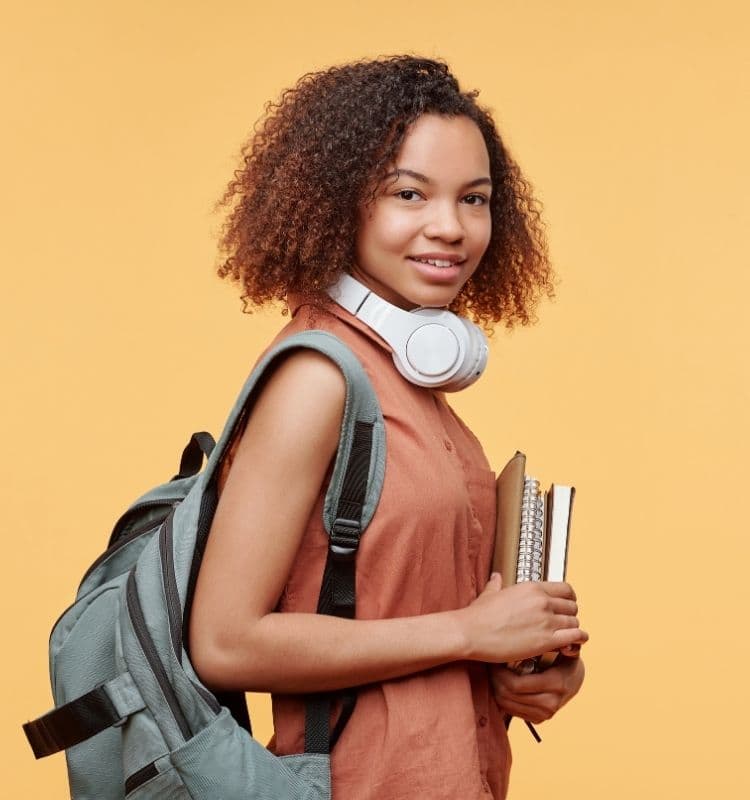 Student with books and headphones
